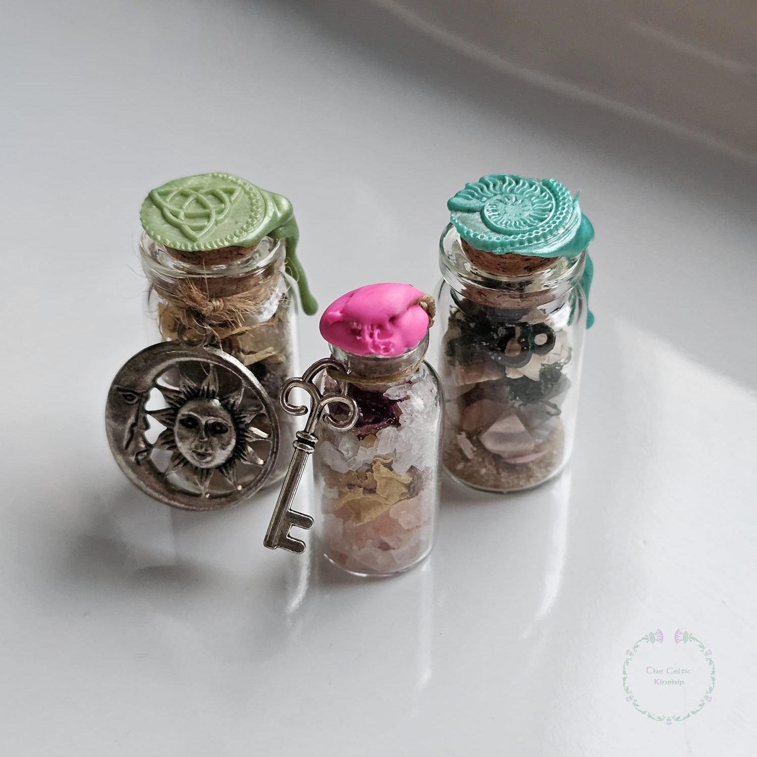 Handmade lucky celtic talisman made by Mozinah with crystals and herbs and petals and wax stamps 