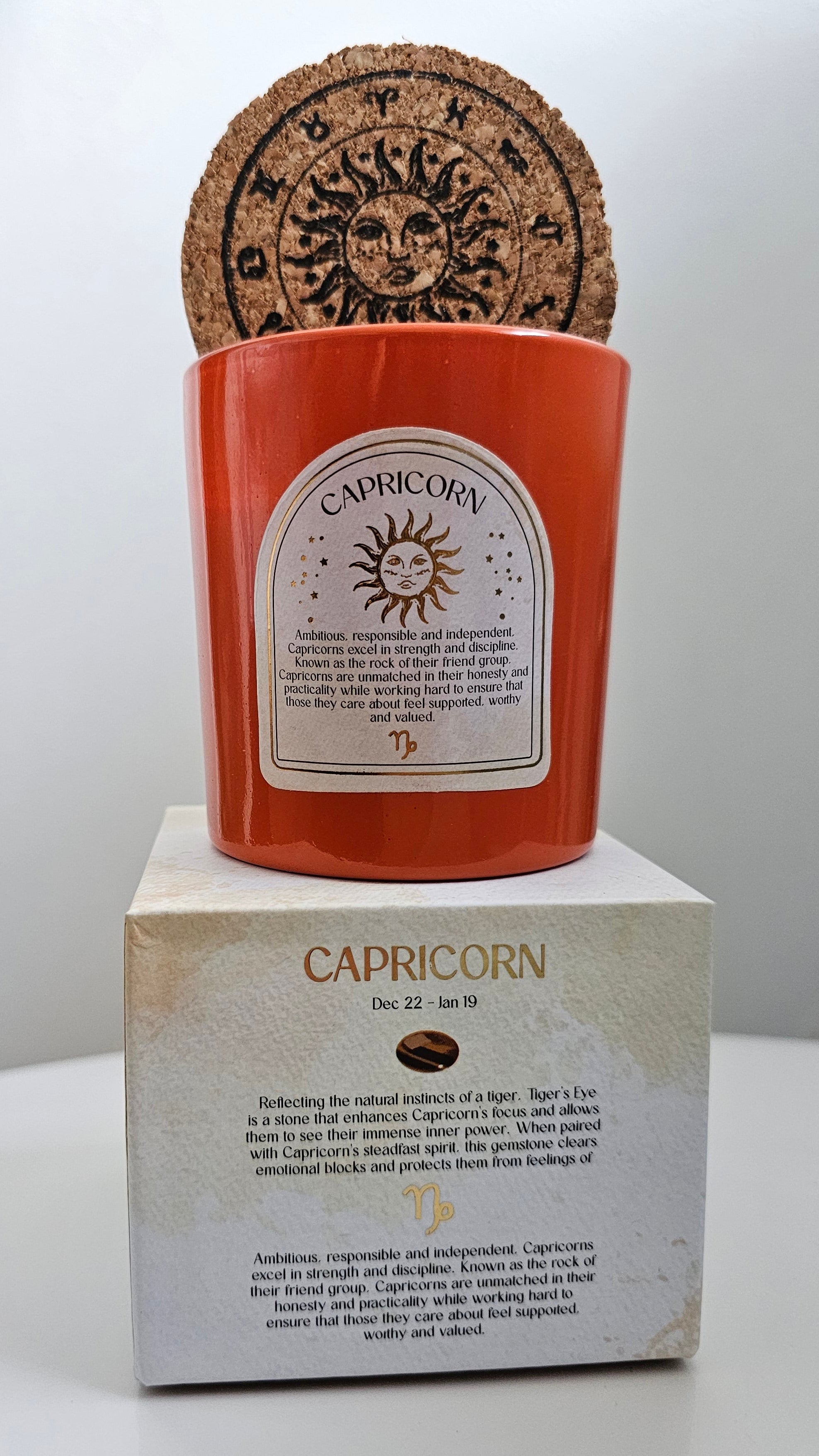Capricorn orange zodiac candle with crystals 